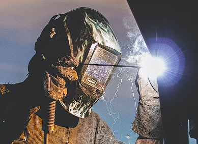 Man in a suit welding