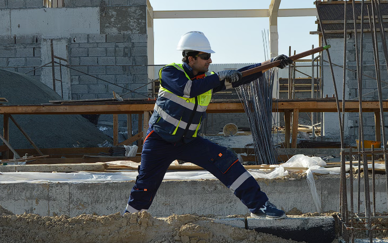 Man standing near rods