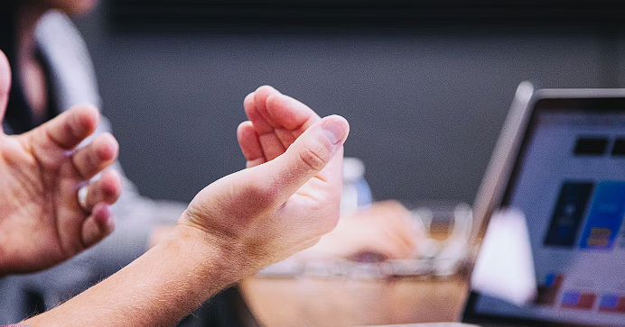 Hands in front of laptop