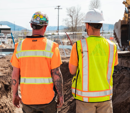 Construction workers on a construction site in a construction safety equipment